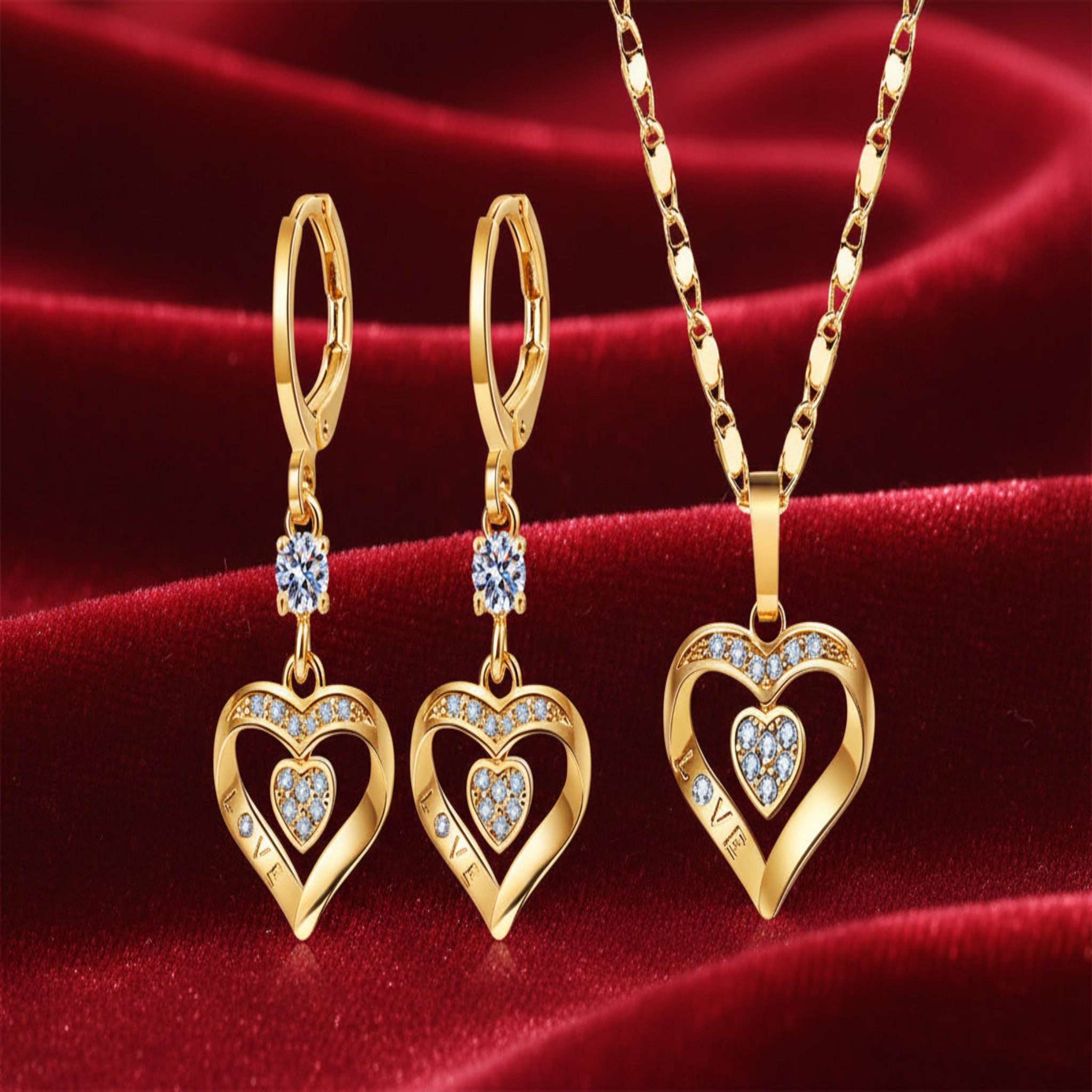 Gold heart-shaped jewelry set with necklace and earrings on a white background