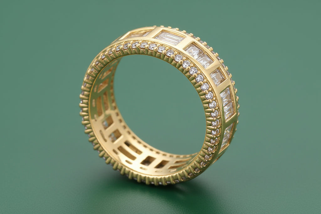 Gold ring with diamond accents on a green background