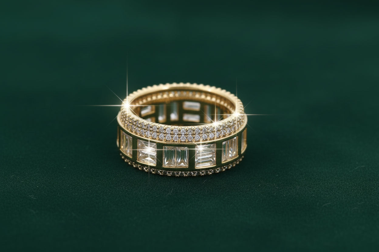 Gold ring with embedded diamonds on a green background