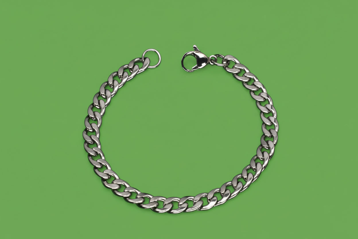 Silver chain bracelet with clasp on a black background