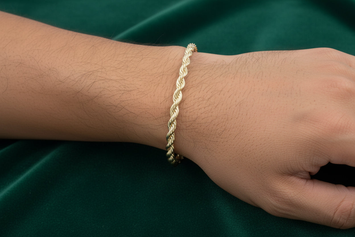 Gold rope chain on a white background