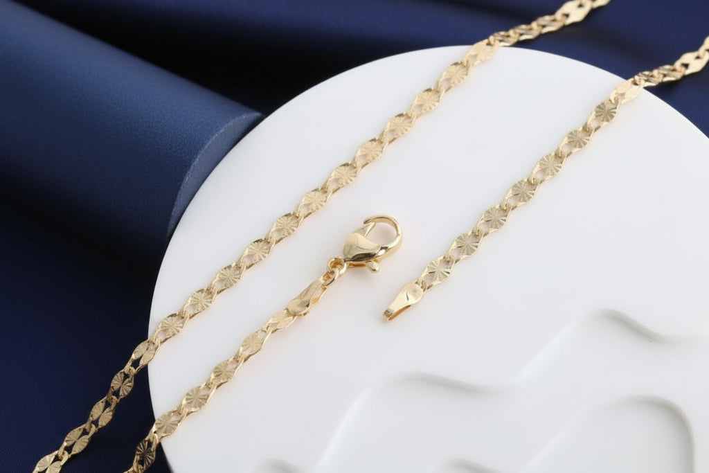Gold chain necklace on a white background